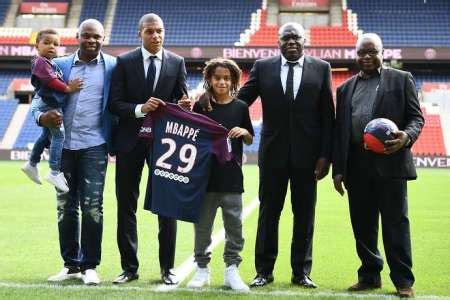 Kylian mbappe stands with brother ethan and father wilfried. Kylian Mbappe-Father Wilfried Mbappe Net Worth ...