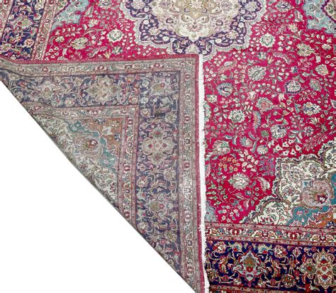 Lot 7 - A large Kashan carpet,