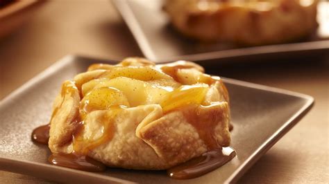 Wrap excess top pie crust under the bottom crust edge, pressing edges together to seal; Mini Apple Crostatas recipe from Pillsbury.com