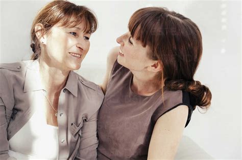 Portrait Of Mother And Daughter Face To Face Stock Photo