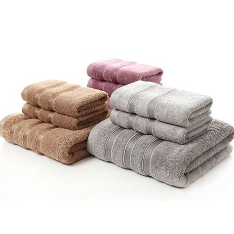 Four Towels Stacked On Top Of Each Other In Different Colors And Sizes
