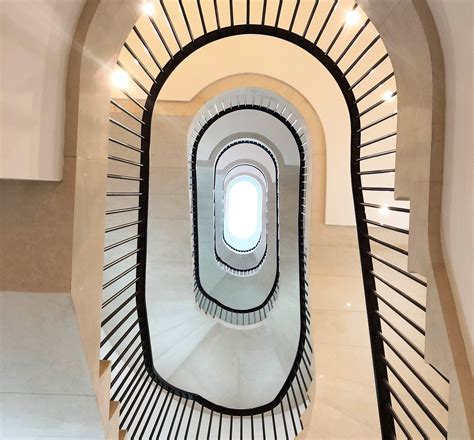 Spiral Staircase Handrail Design Captures The Eye With A Smooth