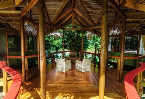 Peeking Out From Between The Parrot Green Palms Of The Dense Costa Rican Rainforest Is Pacuare