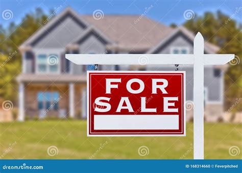 Home For Sale Real Estate Sign In Front Of New House Stock Photo