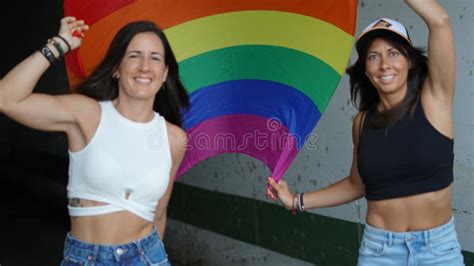 Spanish Lesbian Couple Posing With A Pride Flag Stock Image Image Of