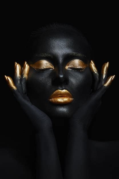 Premium Photo Beauty Woman Painted In Black Skin Color Body Art Gold Makeup Lips Eyelids