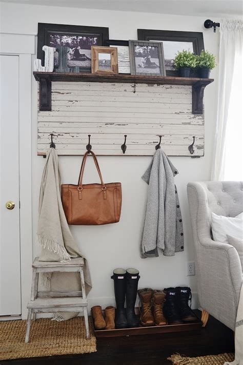 The coat rack frame is built entirely using kee klamp fittings and pipe which is then mounted to the ground and wall. DIY Rustic Entryway Coat Rack - Liz Marie Blog