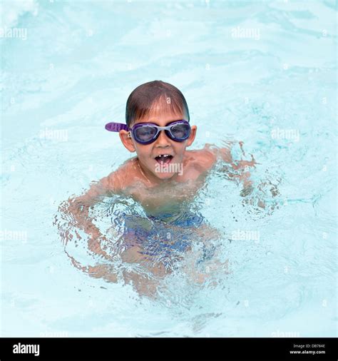 Little Boy Having Fun At The Swimming Pool Stock Photo Alamy