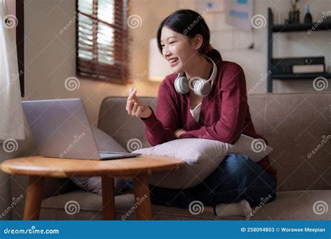 Smiling Young Woman Video Call By Laptop On Sofa At Home Lifestyle Concept Stock Image Image