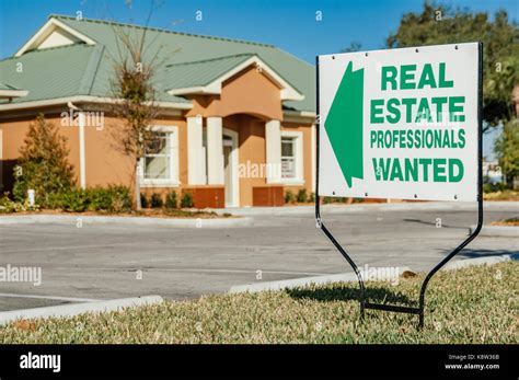 Real estate help wanted sign indicating a booming real estate market