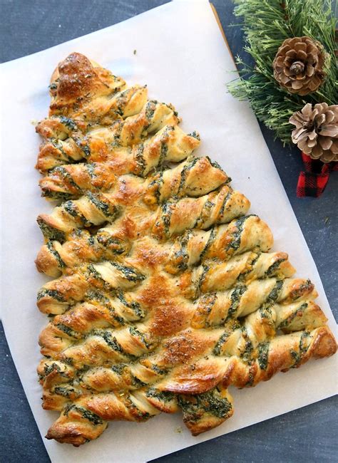 Using a pizza cutter or knife, cut from a bottom corner to the center of the top. Christmas Tree Spinach Dip Breadsticks | Recipe | Appetizer recipes, Christmas cooking, Holiday ...