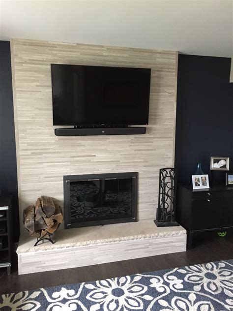 Learn how to prep the old brick and fireplace surround, and how to tile a fireplace for a fresh, modern look! Our old fireplace was 80's/90's brick veneer. To give it an update without spending major ...