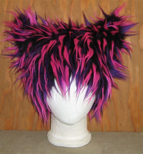 For the colorful cat costume, get yourself a pair of pink tights, a pink and purple feather boa (for the tape), feather earrings, feather lashes, and a pink hoodie dress. Cheshire cat rave costume hat | Cat ears hat, Cat costume diy, Ear hats