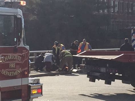 A police officer tends to cam newton following the quarterback's crash on tuesday. the other paper: Cam Newton injured in scary car collision on bridge: Report (PHOTO)