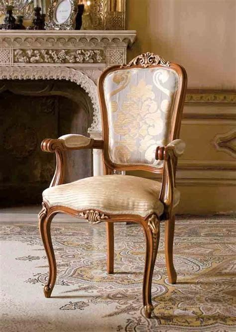The rocking chair, while available in hundreds of different design styles, is marked by its curved band this classic wooden chair dates back to the middle ages, and quickly became a luxury piece. Classic chair head of the table in wood for luxury ...