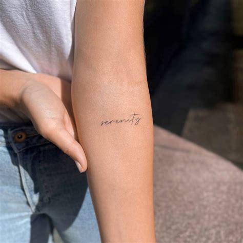 Serenity Lettering Tattoo On The Inner Forearm
