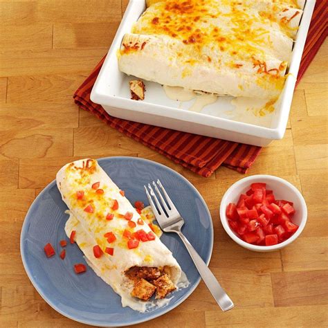 These creamy, easy chicken enchiladas topped with melted cheese and stuffed with onion, bell pepper strips, and green chiles will turn dinner into a mexican fiesta. Makeover Sour Cream Chicken Enchiladas Recipe | Taste of Home