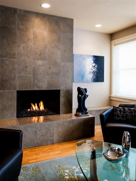 Unlike more traditional fireplaces, this modern take on the design element features a floor to ceiling installation complete with bold white and gray marble. Living Room With Contemporary Fireplace | HGTV