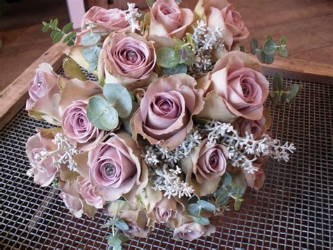 Hand Tied Bouquet Of Amnesia Roses With Eucalyptys And A Silverywhite