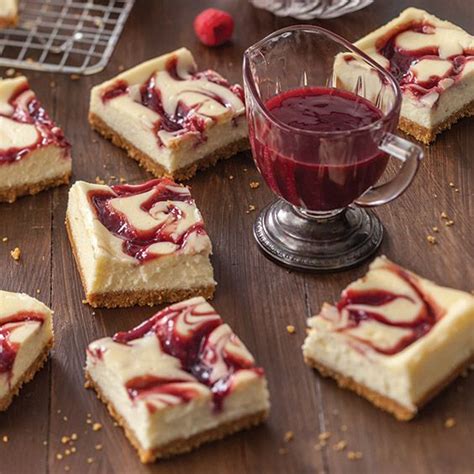 Beat cream cheese and butter in large bowl with electric mixer on medium speed until well blended. Raspberry Swirl Cheesecake Bars - Paula Deen Magazine ...