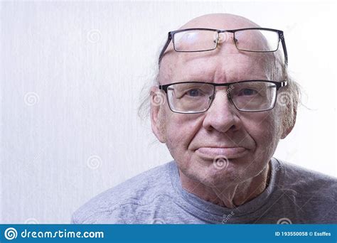 An Old Man With Two Glasses Some Glasses On The Nose Others On The