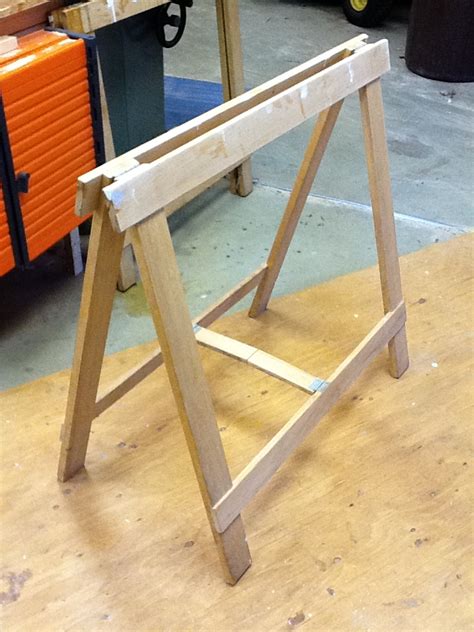 Folding wooden sawhorse plans plans diy free download wood pallet. Folding sawhorse stows away - FineWoodworking