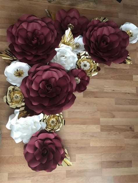 Maybe you would like to learn more about one of these? Burgundy white and gold paper Flowers #paperflowerswedding ...