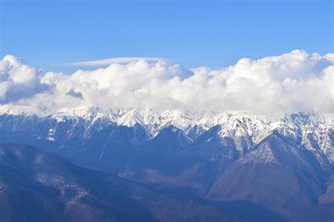 Cumulus Clouds Flying Over A Mountain Range Stock Photo Image Of