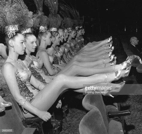 some women are sitting in chairs with their legs spread out