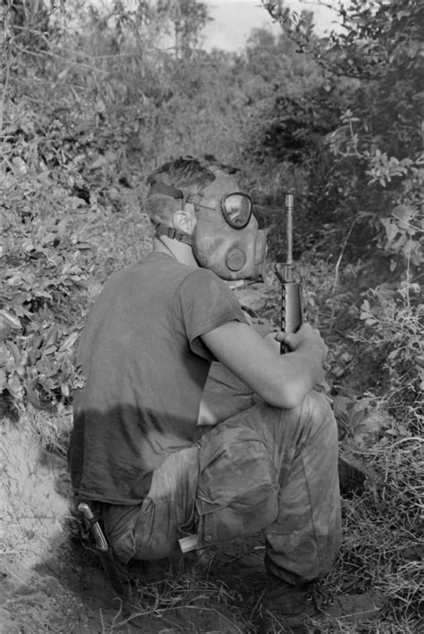 Vietnam War Us Marine Wearing Gas Mask While Waiting To Enter A Viet