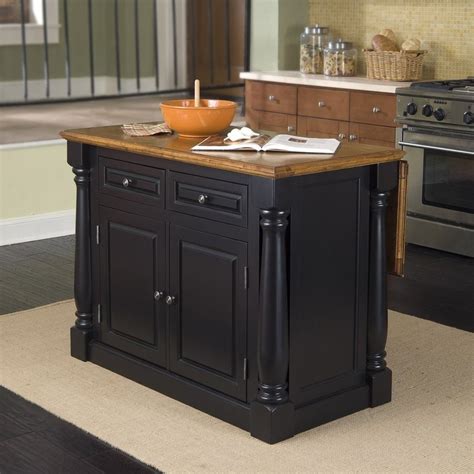 This utility cabinet features a raised panel door in a white thermo foil finish that is durable, scratch resistant, and easy to clean. Home Styles Black Midcentury Kitchen Islands at Lowes.com