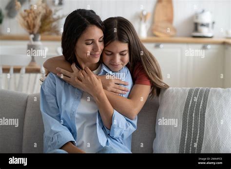 Teen Daughter Embracing Mother Expressing Gratitude Telling Mom She