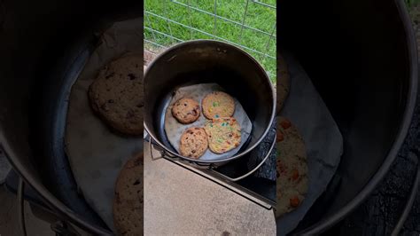 A copper fire pit is a beautiful addition to any outdoor living space. Cookie cooking over a fire - YouTube
