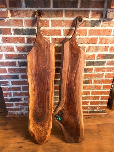 Maybe you would like to learn more about one of these? A pair of black walnut live edge charcuterie boards ...