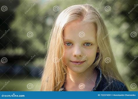 Portrait Of A Beautiful Blonde Little Girl With Long Hair Stock Image