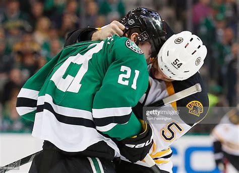 Antoine Roussel Of The Dallas Stars Fights With Adam Mcquaid Of The