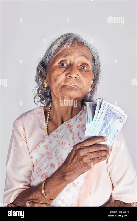 1 Indian Old Senior Woman Saving Money Stock Photo Alamy