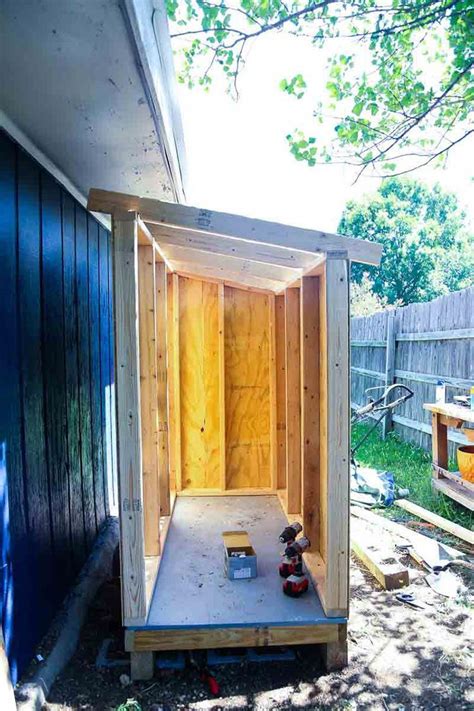This Small Wooden Shed Is Big Enough To Store A Lawn Mower And Some