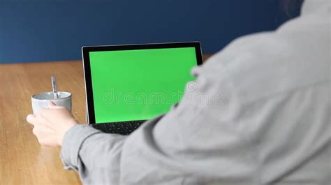 Over The Shoulder Shot Of A Business Person Working At Home On Pc