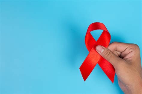 Woman Hand Holding Red Ribbon Hiv Awareness Concept World Aids Day And World Sexual Health Day