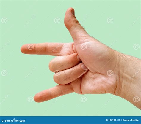 Closed Hand With Open Thumb Index And Little Finger And Green