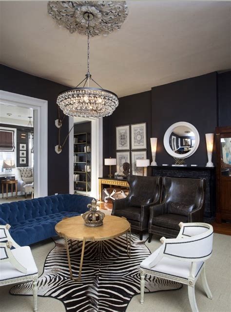 Art Deco Living Room with navy blue tufted sofa | Black living room