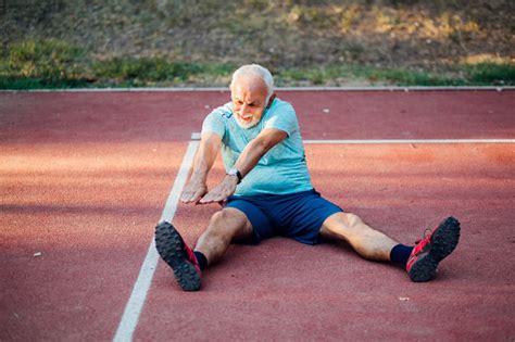Old Man Stretching Stock Photo Download Image Now 60 69 Years