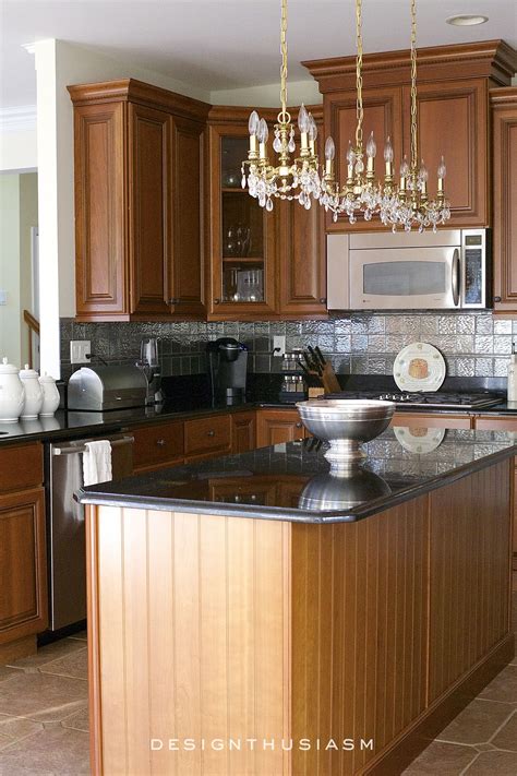 Next, use a sponge or microfiber cloth dampened with warm water to gently remove the. Dramatic Kitchen Renovation without Removing Cabinets ...