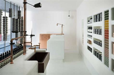 A White Room With Shelves Filled With Bottles