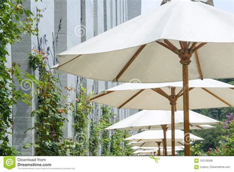 Â Cafe Tables And Chairs Outside With Big White Umbrella Stock Photo