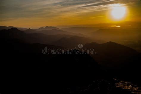 Dark Silhouettes Of The Carpathian Rocky Mountains And Sunset Sky With