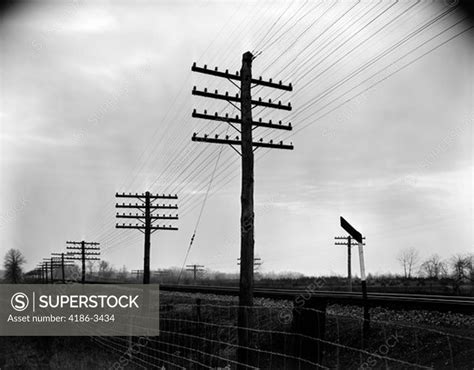 1930s 1940s Telegraph And Telephone Poles And Wires Along Railroad