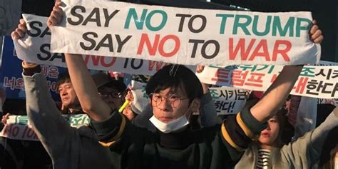 South Koreans Greet Warmongering Trump With Clear Message Shut Up
