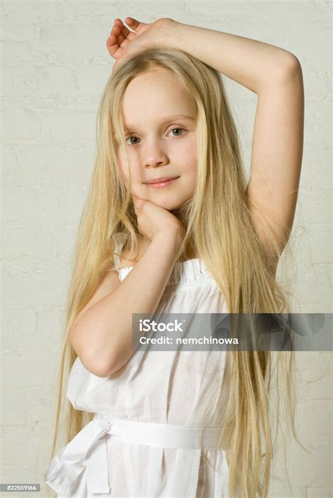 Smiling Blonde Girl With Long Hair Stock Photo Download Image Now
